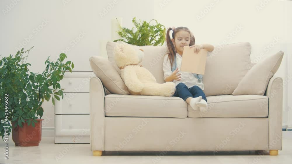 4k video where little girl is reading a book. 4k video where little girl is reading a book.
