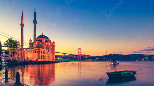 Ortakoy Istanbul panoramic landscape beautiful sunrise with clouds Ortakoy Mosque and Bosphorus Bridge, Istanbul Turkey. Best touristic destination of Istanbul. Romantic view of Istanbul city.