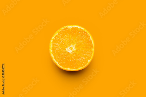 Slice of orange isolated on orange background