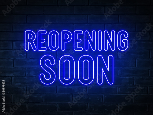 Reopening soon  - blue neon light word on brick wall background	

