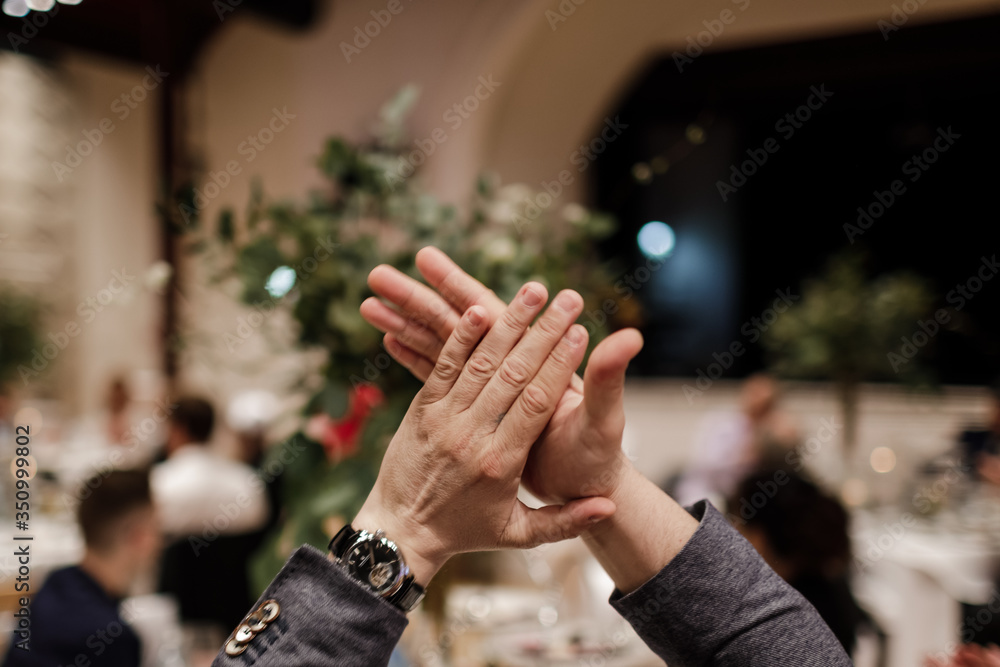 The guest at the banquet applauds. Hands applause. Men's hands applaud. The guest at the banquet applauds. Hands applause. Men's hands applaud.