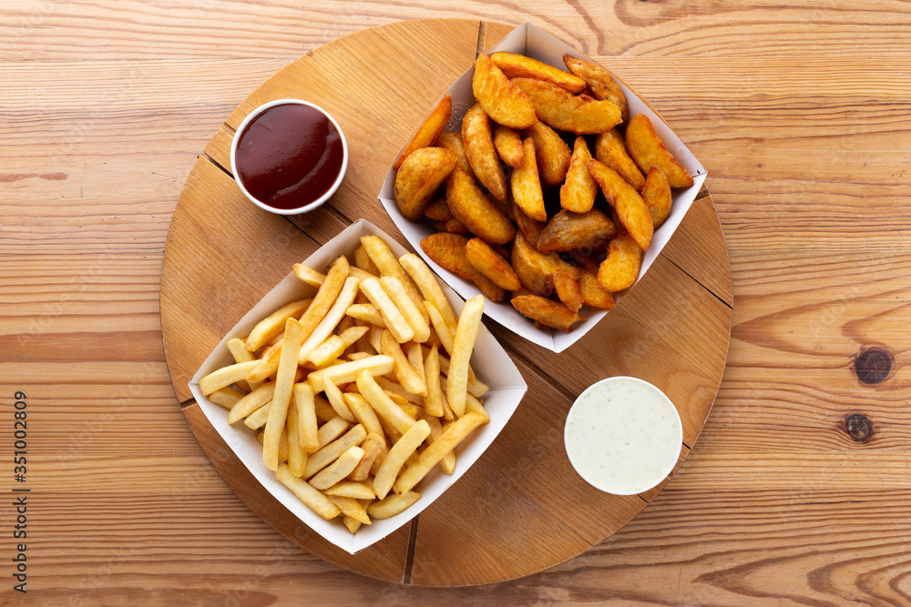 .french fries on a wooden board