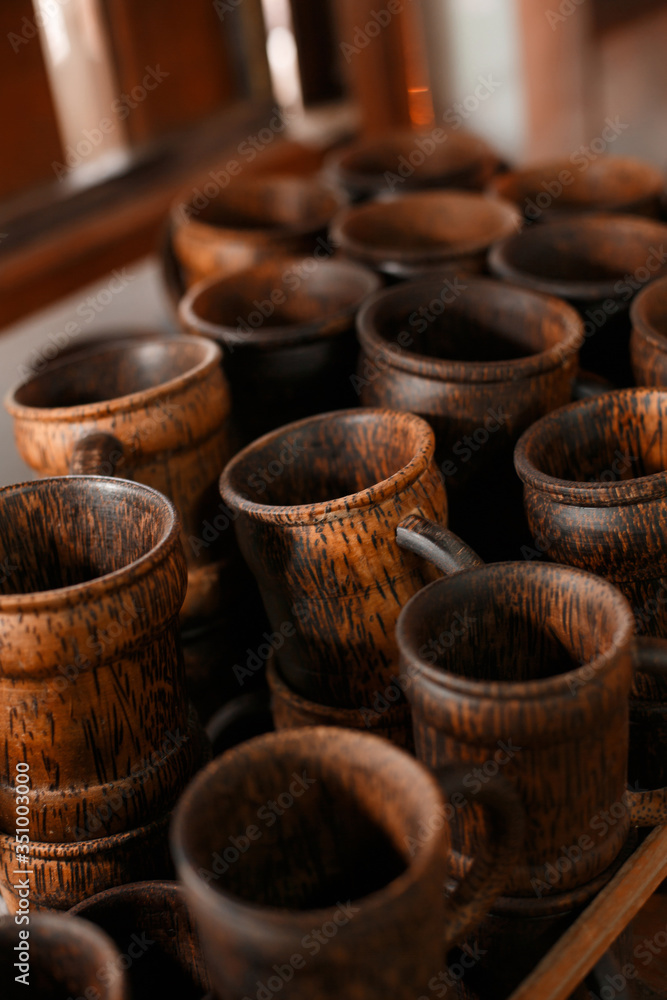 Thai dishes made from natural materials. Many wood mugs for tea