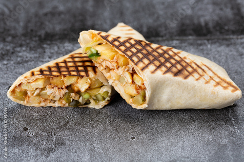 roll of chicken, cucumbers and fries. grilled shawarma
