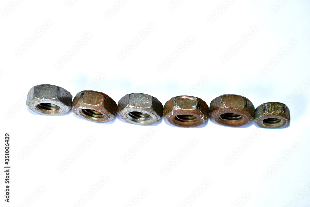 Rusty iron nuts on a white background Rusty iron nuts on a white background