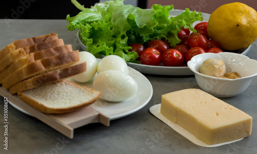 
Caesar Salad and ingredients on table background