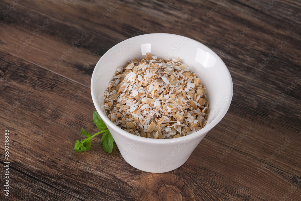 Raw oats in the bowl Raw oats in the bowl