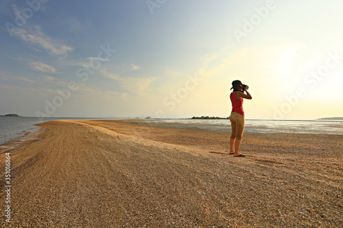 The tourists are taking pictures of Thale Waek or Separated Sea is a wonders of the Dragon spine beach Satun Province Thailand photo