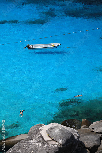 Tourists floating on the crystal clear waters. Enjoy the beauty of the sea at Similan sea  © kosin_sukhum