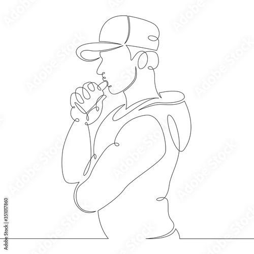 young man smokes a vape electronic cigarette