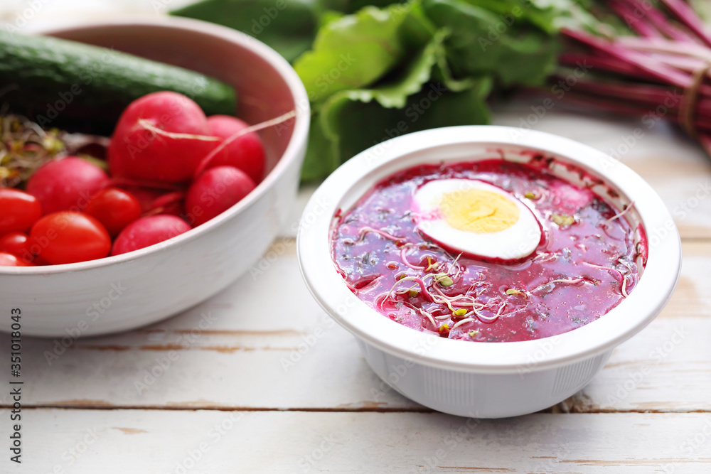 Beet soup in a plastic bowl. Dietary catering with home delivery. An appetizing dish of a balanced diet served in a plastic disposable dish. Beet soup in a plastic bowl. Dietary catering with home delivery. An appetizing dish of a balanced diet served in a plastic disposable dish.