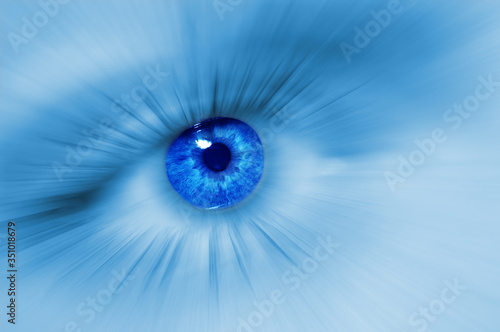 Macro blue eye. Divergent abstract rays from the pupil of the human eye. Concept of dreams or abstraction, purity or treatment of vision. Macro
