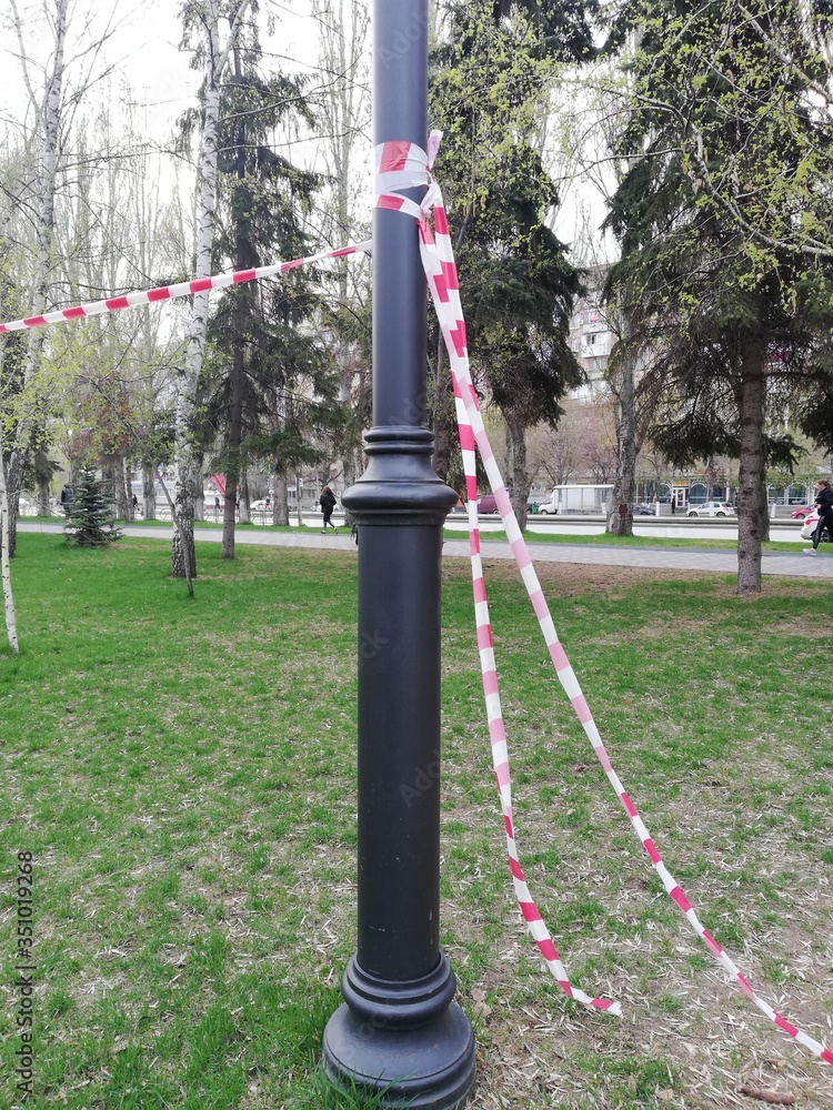 Park, square with playgrounds fenced with ribbons during the coronavirus, quarantine, pandemic. Children on playgrounds, dogs in parks and squares. Park, square with playgrounds fenced with ribbons during the coronavirus, quarantine, pandemic. Children on playgrounds, dogs in parks and squares.