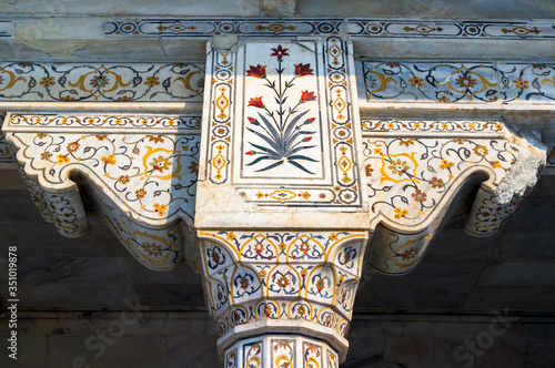 фотографія Detail of white marble pillar inlaid with semi previous stones in a Mughal Palac