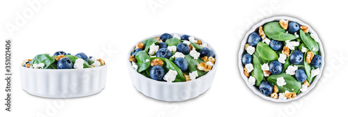 Spinach blueberry walnut Feta salad on a white isolated background