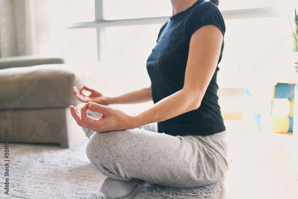 Woman practicing yoga in various poses. Lotus, padmasana