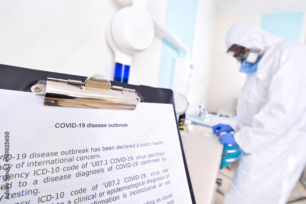 Doctor in protective suit uniform and mask in laboratory. Doctor in protective suit uniform and mask in laboratory.