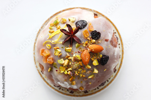 Delicious dessert pie with slices of dried fruit and almonds