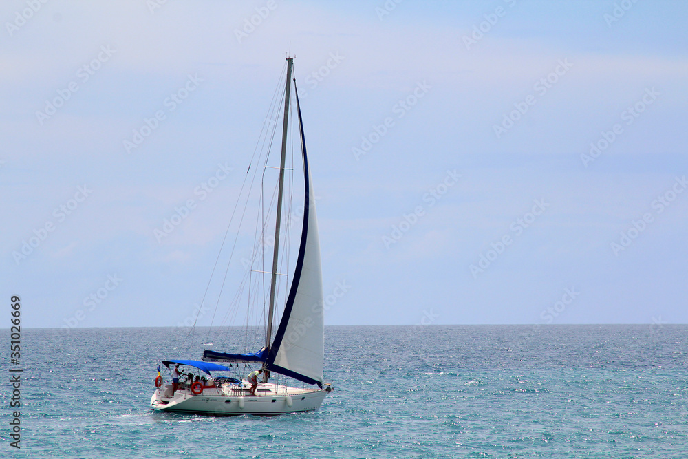 Sailing yacht in the sea against the blue sky