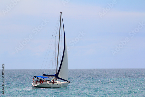 Sailing yacht in the sea against the blue sky