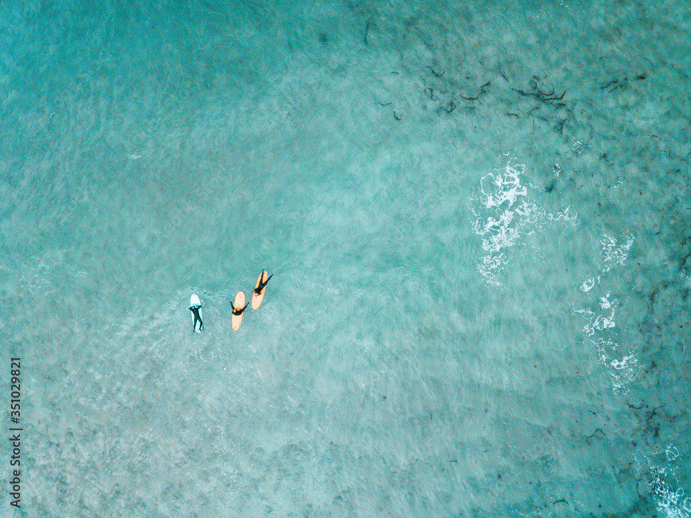 drone view surfers in the sea