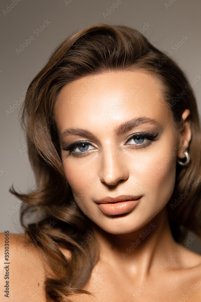 Portrait of a beautiful woman with makeup and styling. Blue eyes, fashionable eyebrows and beautiful lips. Portrait of a beautiful woman with makeup and styling. Blue eyes, fashionable eyebrows and beautiful lips.