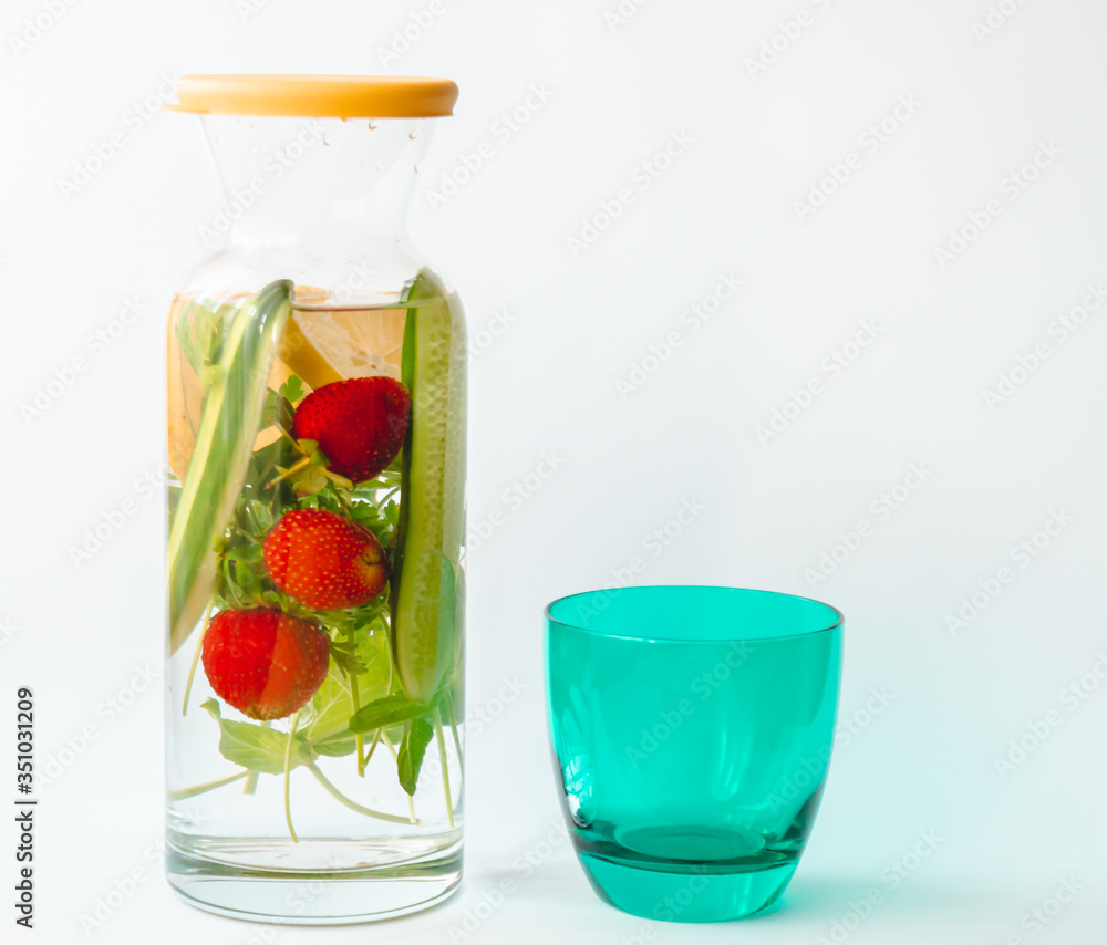 strawberry parsley cucumber mint added to water in a jug for slimming diet strawberry parsley cucumber mint added to water in a jug for slimming diet