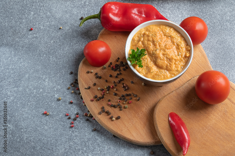 cream soup with paprika and tomatoes. Dietary and vegan dish on a wooden board top view
cream soup with paprika and tomatoes. Dietary and vegan dish on a wooden board top view