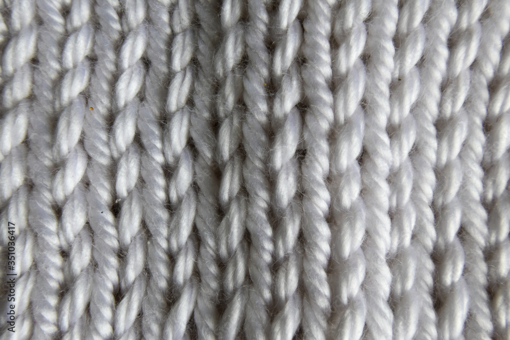 close up of white thick wool knitted up close up of white thick wool knitted up