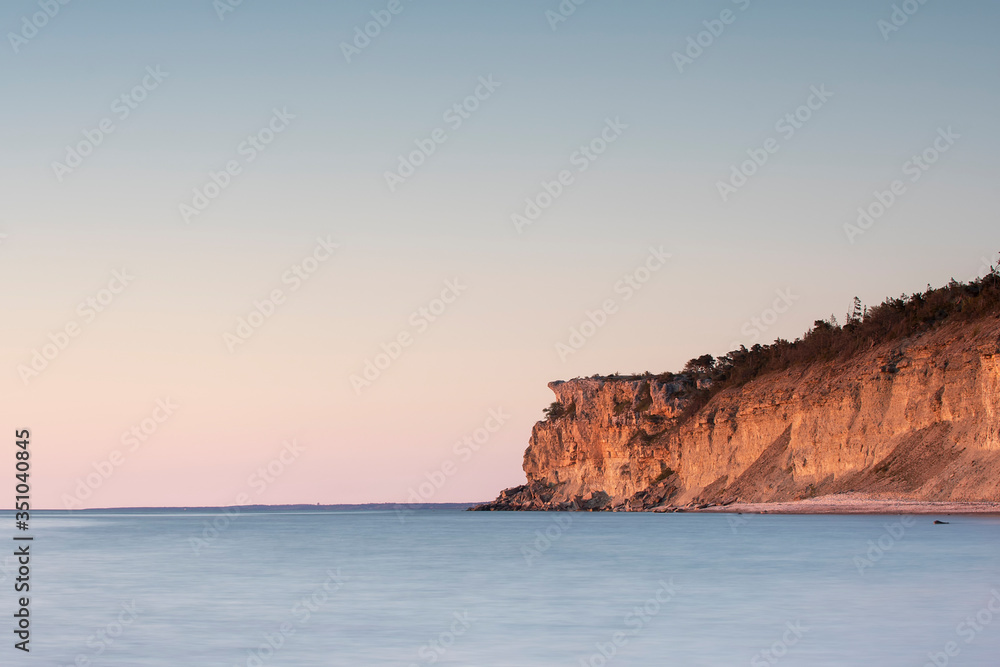 Sunset over limestone cliff, long exposure