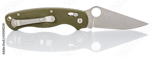 Side view of open folding pocket knife with matte blade and green composite plastic cover plates on steel handle isolated on white background with reflection on glossy surface. Pocket knife close-up