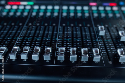 buttons equipment in audio recording studio of the green colour