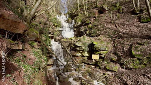 Waterfalls in a gorge carry a lot of water after heavy rains photo