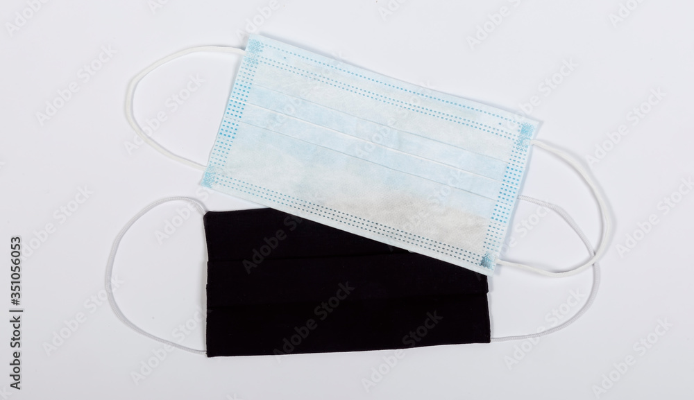 Blue medical mask and black medical mask on a white background Blue medical mask and black medical mask on a white background