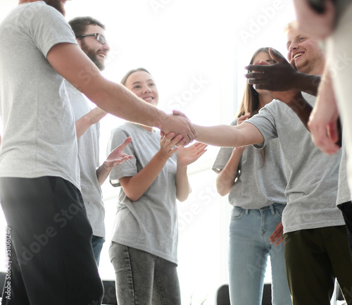 young people greet each other in the conference room.