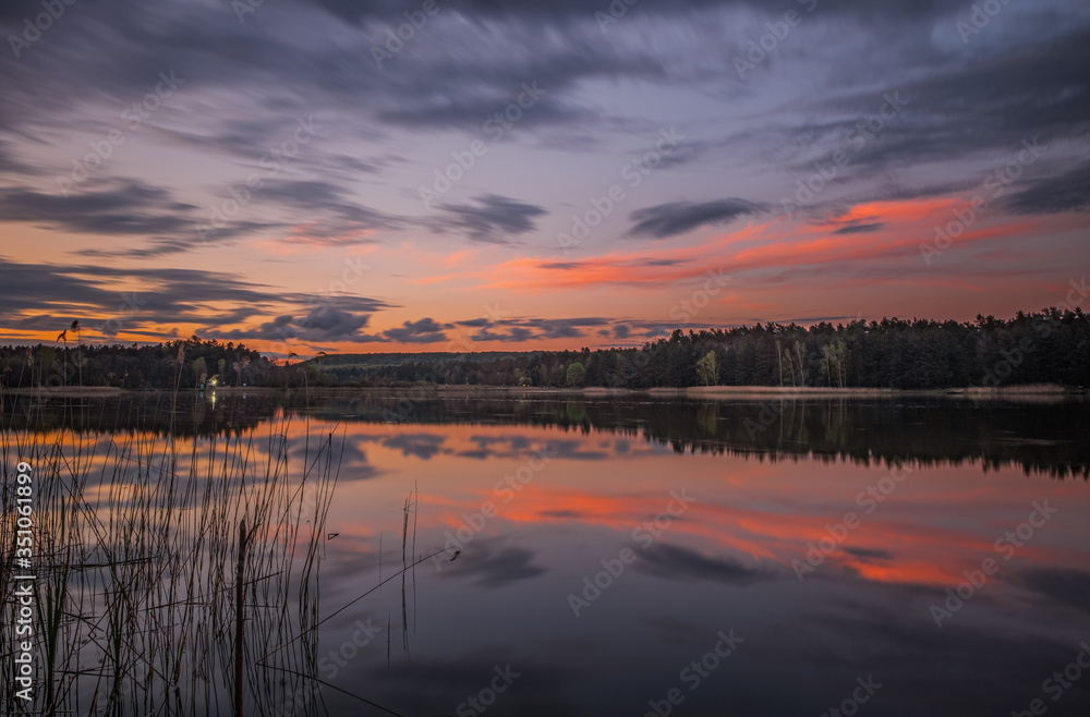Evening (sunset) landscape with lake, spring and forest in Vereshchytsia, Lviv district. May 2020. Long exposure picture