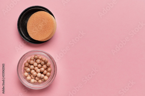Powder on a pink background with copy space.