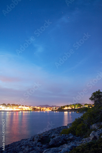 Village of Portopetro, at night as seen from a sailboat in the Marina, Majorca, Balearic Islands, Spain, Europe