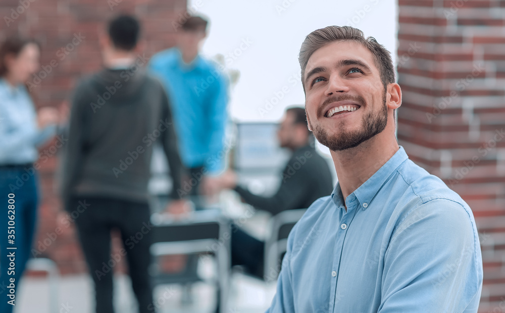 Cheerful man smiling in office. Cheerful man smiling in office.