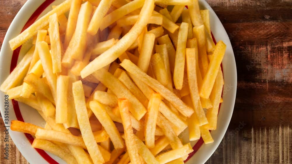 French fries on dish with smoke. Top view. French fries on dish with smoke. Top view.