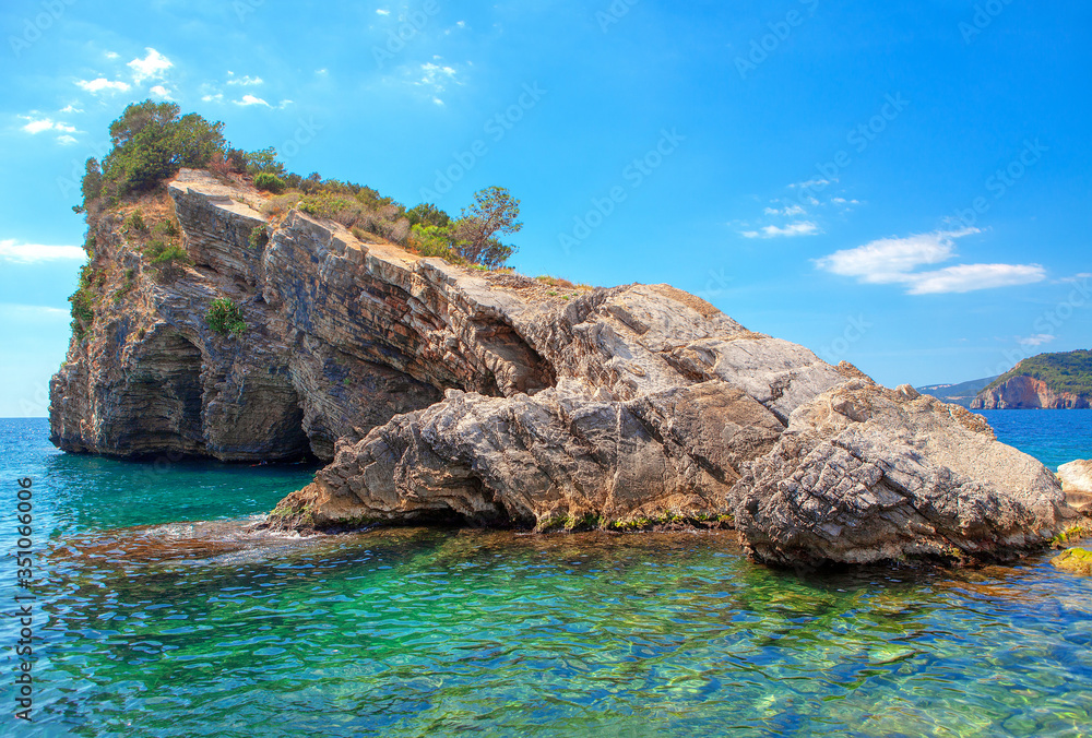 tropical scenery with rock formation in the sea water