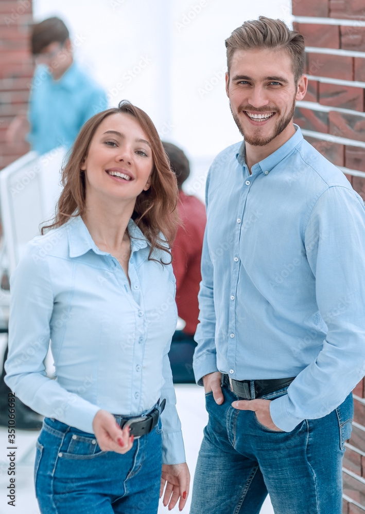 Portrait of smiling designers standing in office. Portrait of smiling designers standing in office.