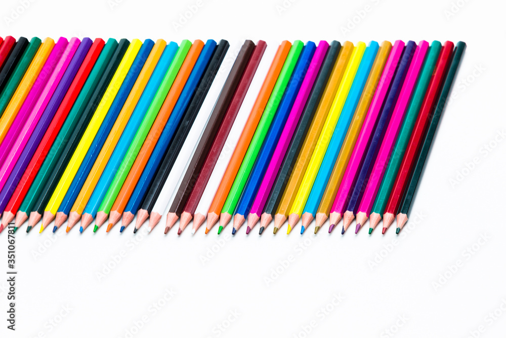 Obraz premium Craft Ideas. Closeup of Various Colorful Pencils Placed Together in Row. Isolated Against White.Picture made from Upper View.
