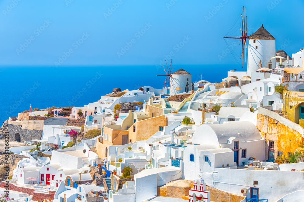 Greece Traveling. View of Greek Traditional Colorful Houses and Windmills of Oia or Ia at Santorini Island in Greece at Daytime.