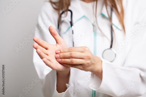 Doctor uses an antiseptic to disinfect the hands