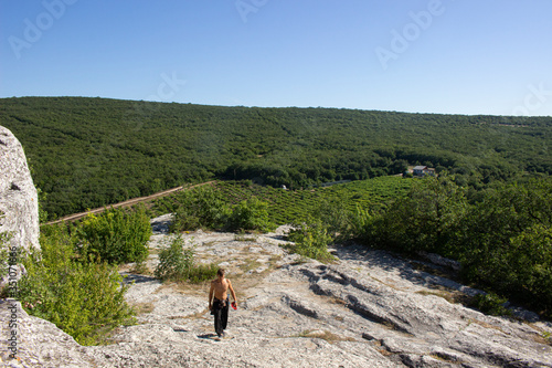 The guy walks around the cave city