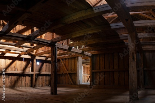 Interior of large old wooden German Barn during renovation, looking up from the middle floor