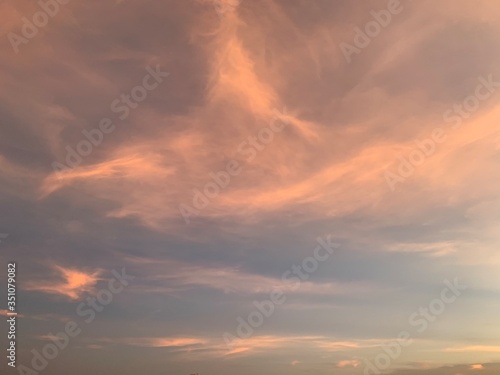 Background of colorful sky concept: Dramatic sunset with twilight color sky and clouds, Natural colors Evening sky Shine new day for Heaven,The light from heaven from the sky is a mystery.