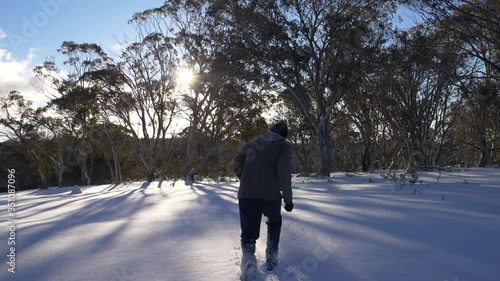 Man walking in deep powder snow, SLOW photo