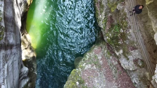 Flying up in the Areuse canyon with green water and a look at the drone pilot photo